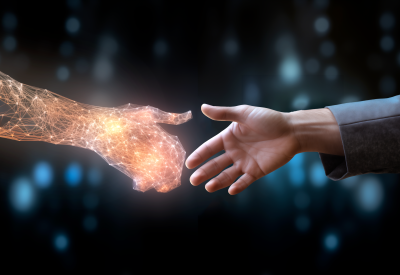 Handshake zwischen KI und Mensch
